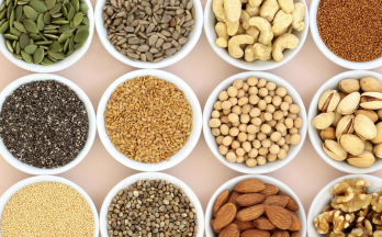 An assortment of bowls of nuts and seeds