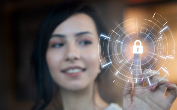 Women touching transparent screen with lock icon Women touching transparent screen with lock icon