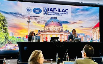 Abdel Kassou co-chairs a digital transformation working group at the IAF-ILAC Joint Annual Meetings in Berlin, Germany, with a backdrop of the Berlin skyline. Abdel Kassou co-chairs a digital transformation working group at the IAF-ILAC Joint Annual Meetings in Berlin, Germany, with a backdrop of the Berlin skyline.