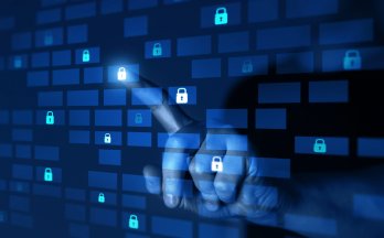 Hand pointing at digital padlocks on a blue virtual interface.