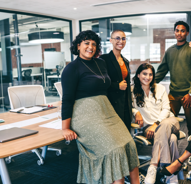 diverse group of smiling employees in an office