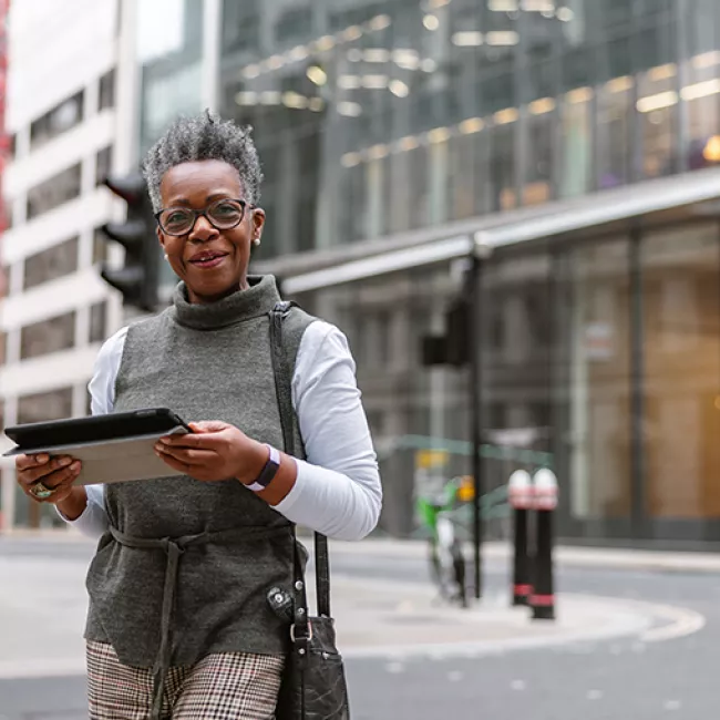  smiling woman with laptop