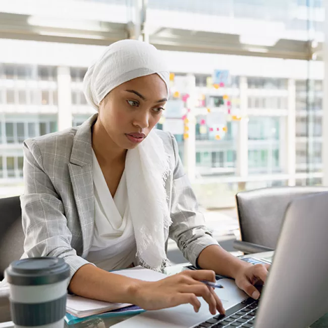 business woman looking at laptop