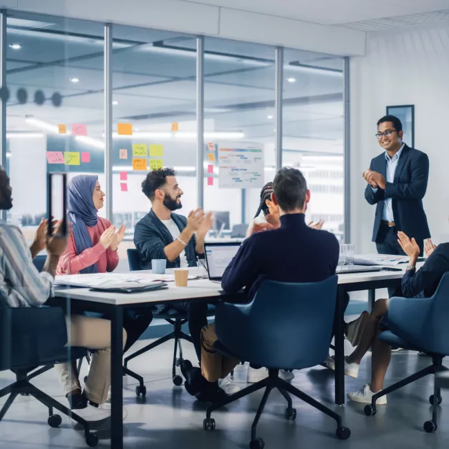 Team meeting at a table in an office