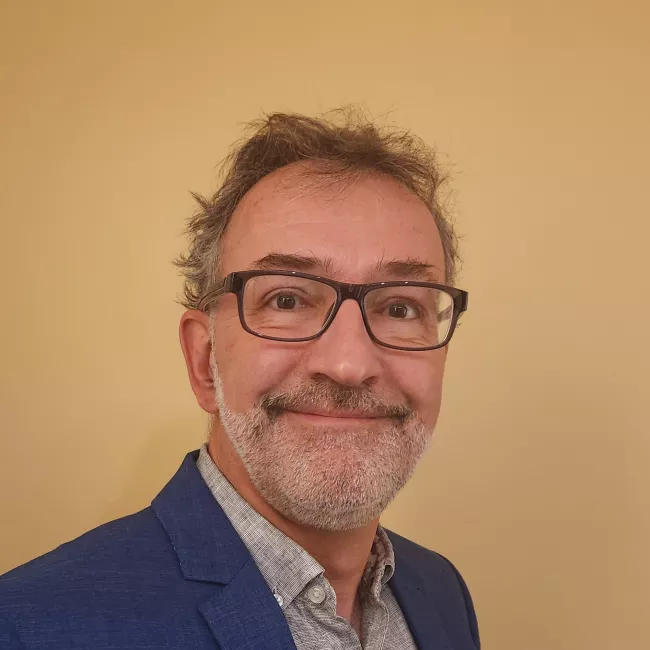 Headshot of Benoit Desforges, man in blue suit