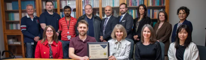 The Canadian Nuclear Safety Commission along with SCC staff are in a group picutre