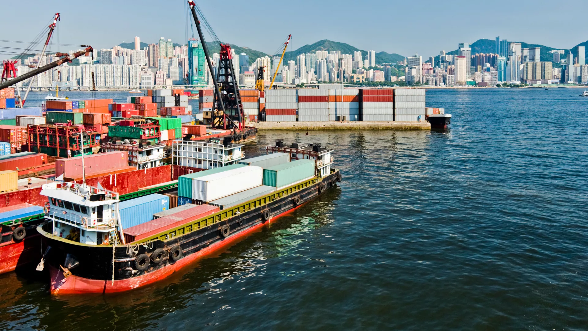 Boats loading shipping containers