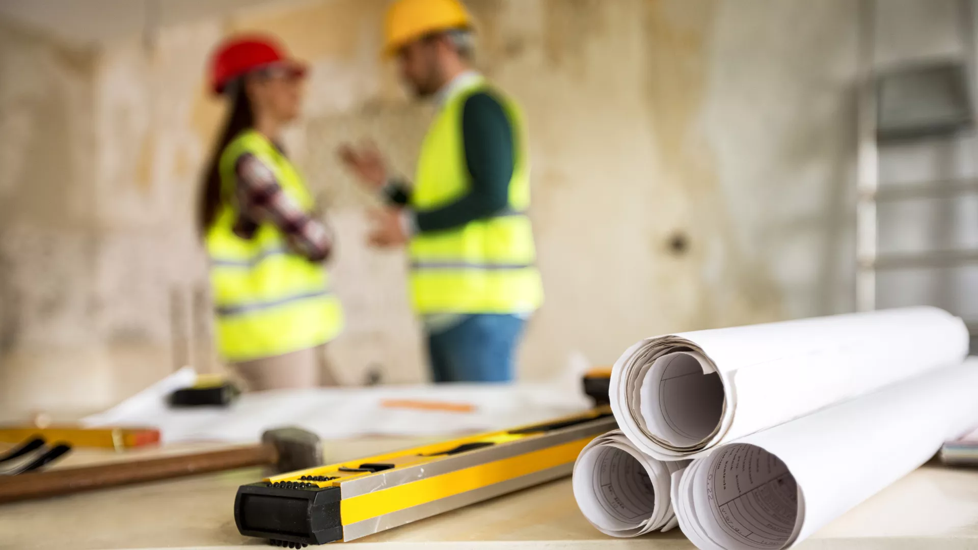 Two people at a construction site