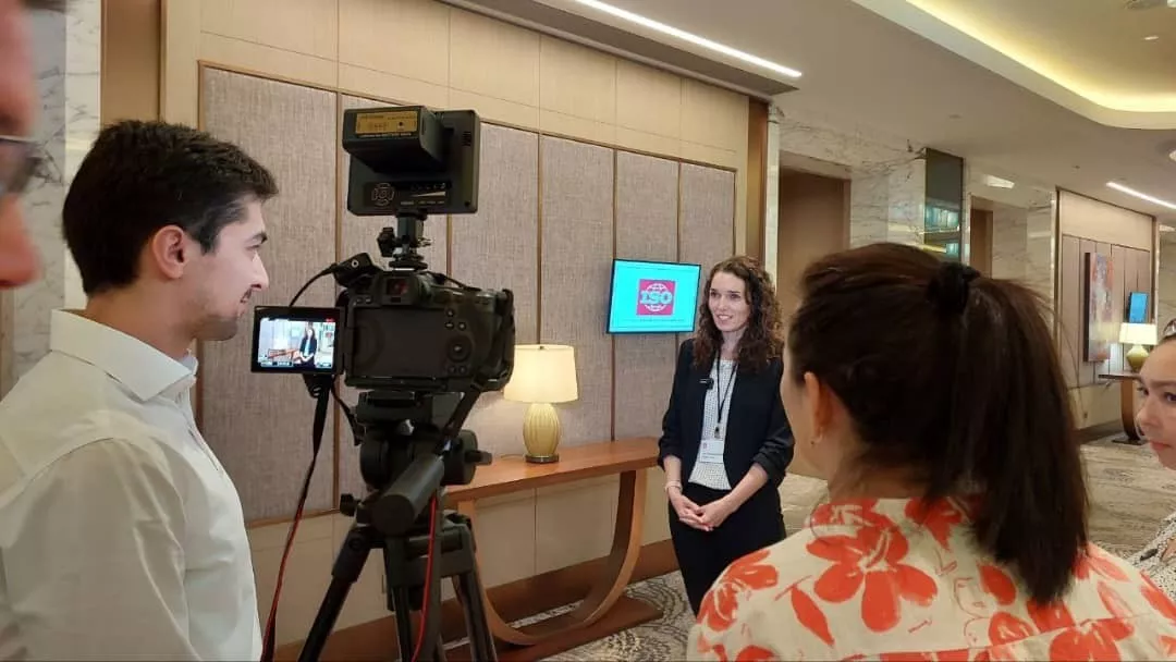 Michelle Parkouda is being interviewed on camera by a reporter at the UN