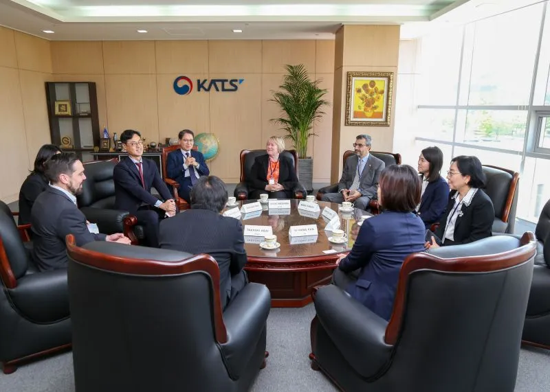 Delegates seated in a formal meeting at KATS during a peer evaluation visit. Delegates seated in a formal meeting at KATS during a peer evaluation visit.